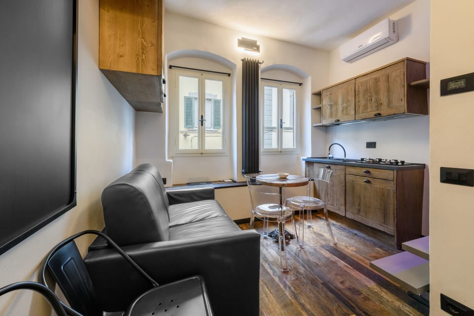 City Apartment | Living area | 40-inch flat-screen TV with digital channels