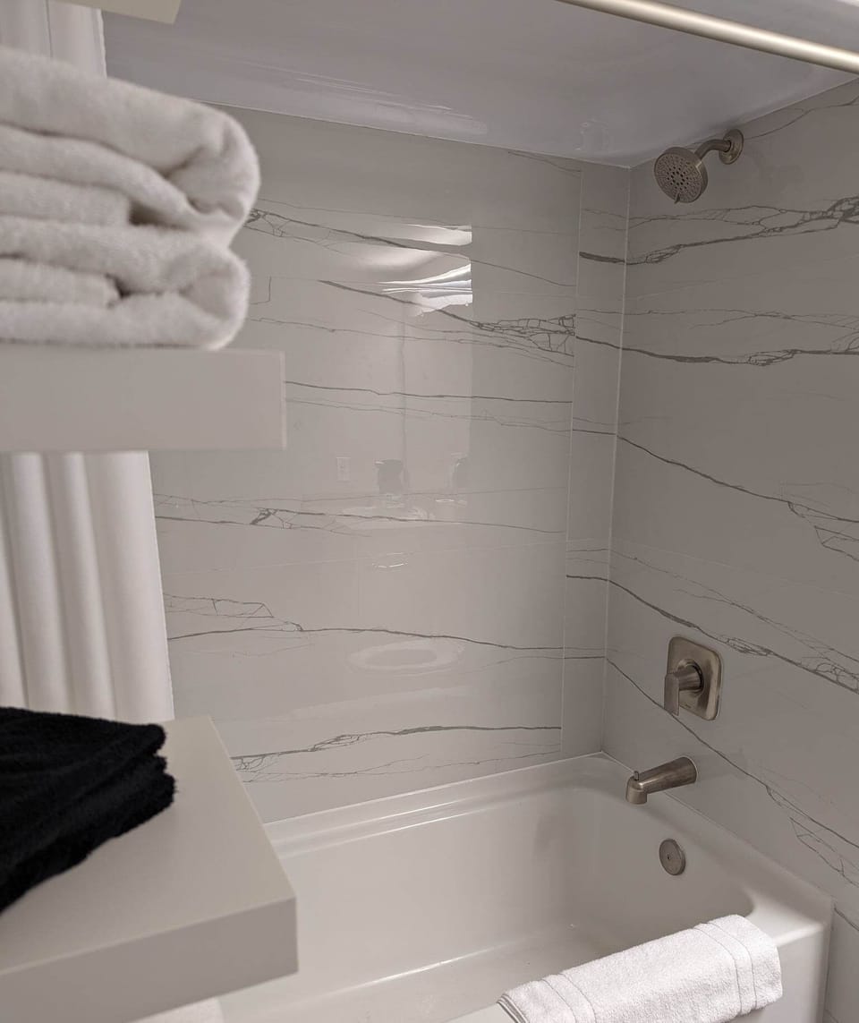 Economy Room, Harbor View | Bathroom | Combined shower/tub, hair dryer, towels