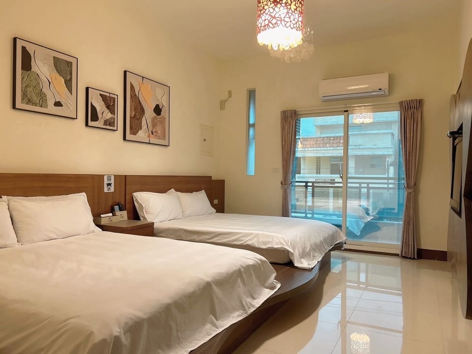 Deluxe Quadruple Room, City View | Pillowtop beds, free WiFi