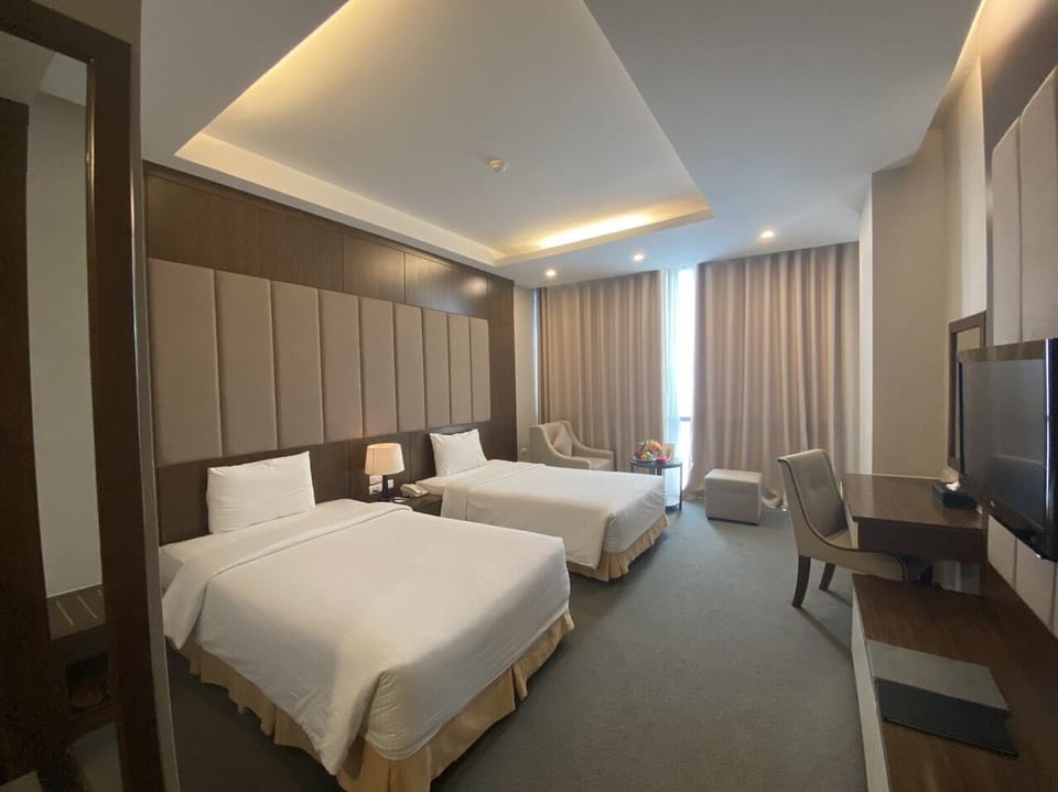 Deluxe Double or Twin Room | Minibar, in-room safe, desk, rollaway beds