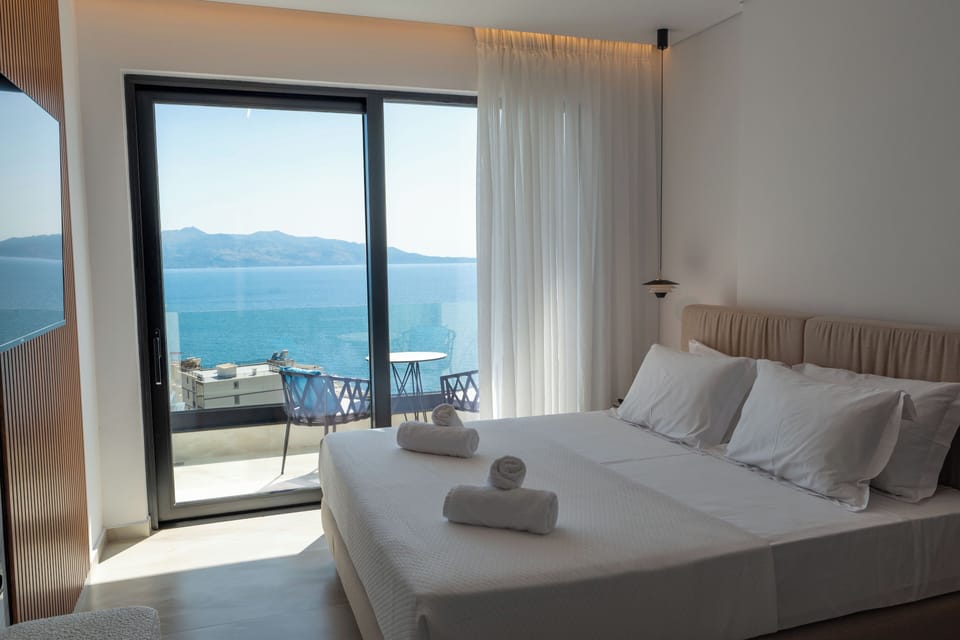 Family Suite, Sea View | Minibar, in-room safe, desk, blackout drapes
