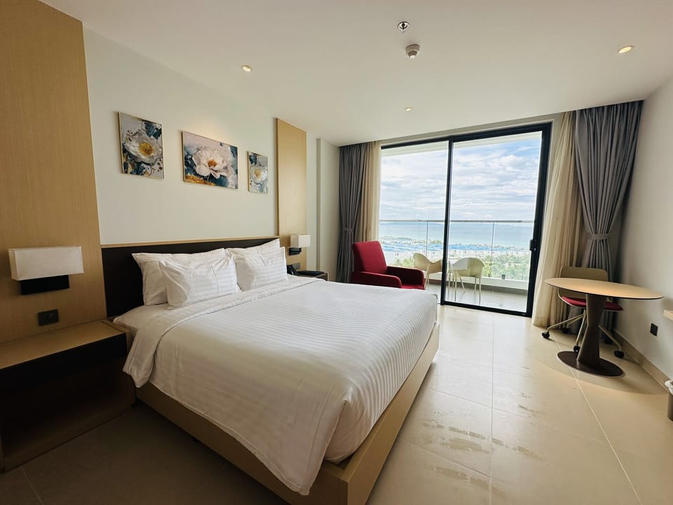 Deluxe Double Room, Partial Ocean View | In-room safe, blackout drapes, iron/ironing board, WiFi (free)