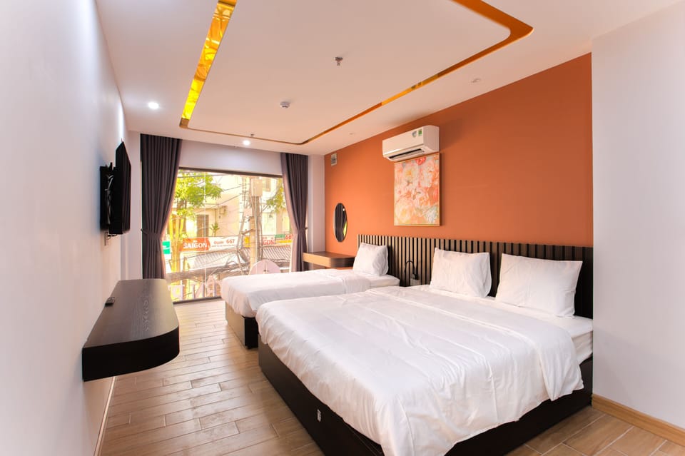 Family Quadruple Room | Minibar (some free items), in-room safe, desk, blackout drapes