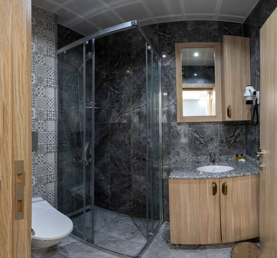 Shower, hair dryer, slippers, towels