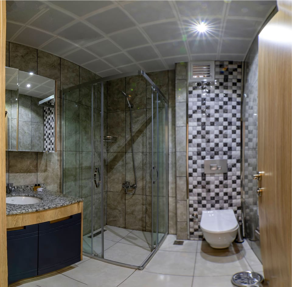 Shower, hair dryer, slippers, towels