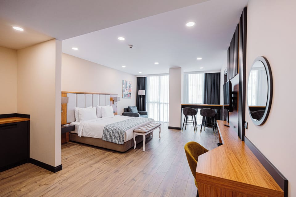 Family Room, Multiple Beds, Non Smoking, Kitchenette (Separate Living Room) | 1 bedroom, minibar, in-room safe, soundproofing