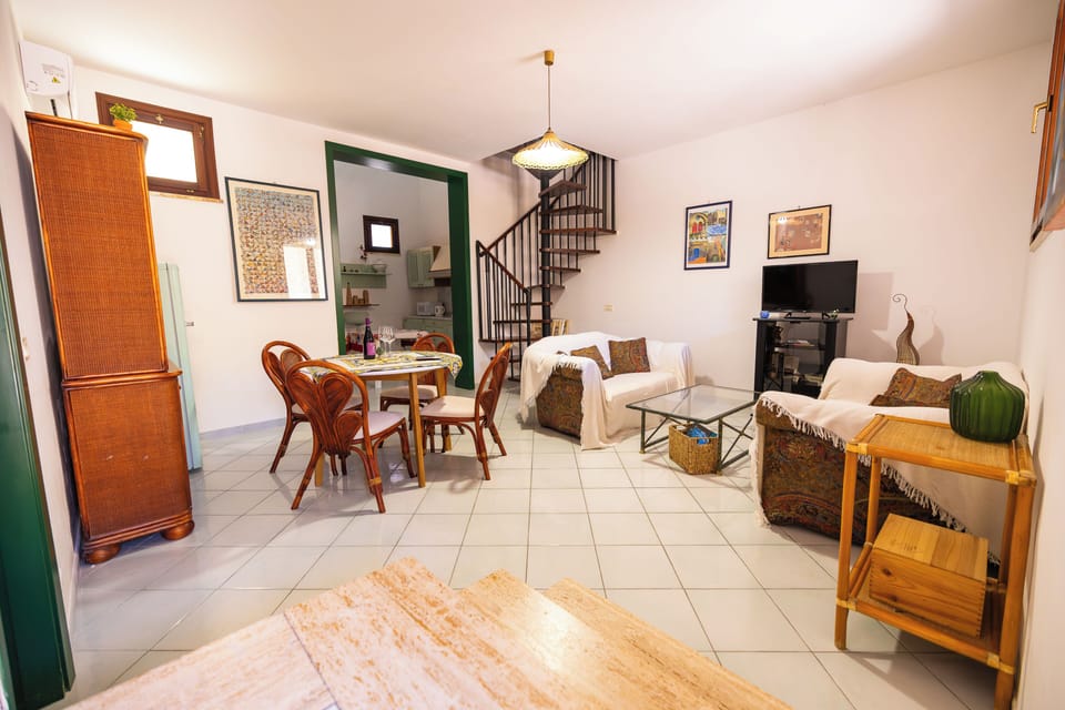 Family Duplex, Kitchen, Ground Floor | Living area | 40-inch flat-screen TV with cable channels