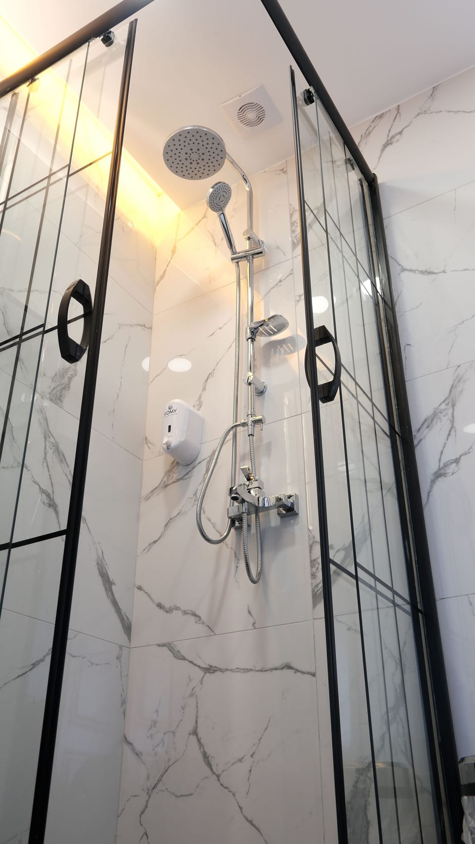 Shower, hair dryer, slippers, towels