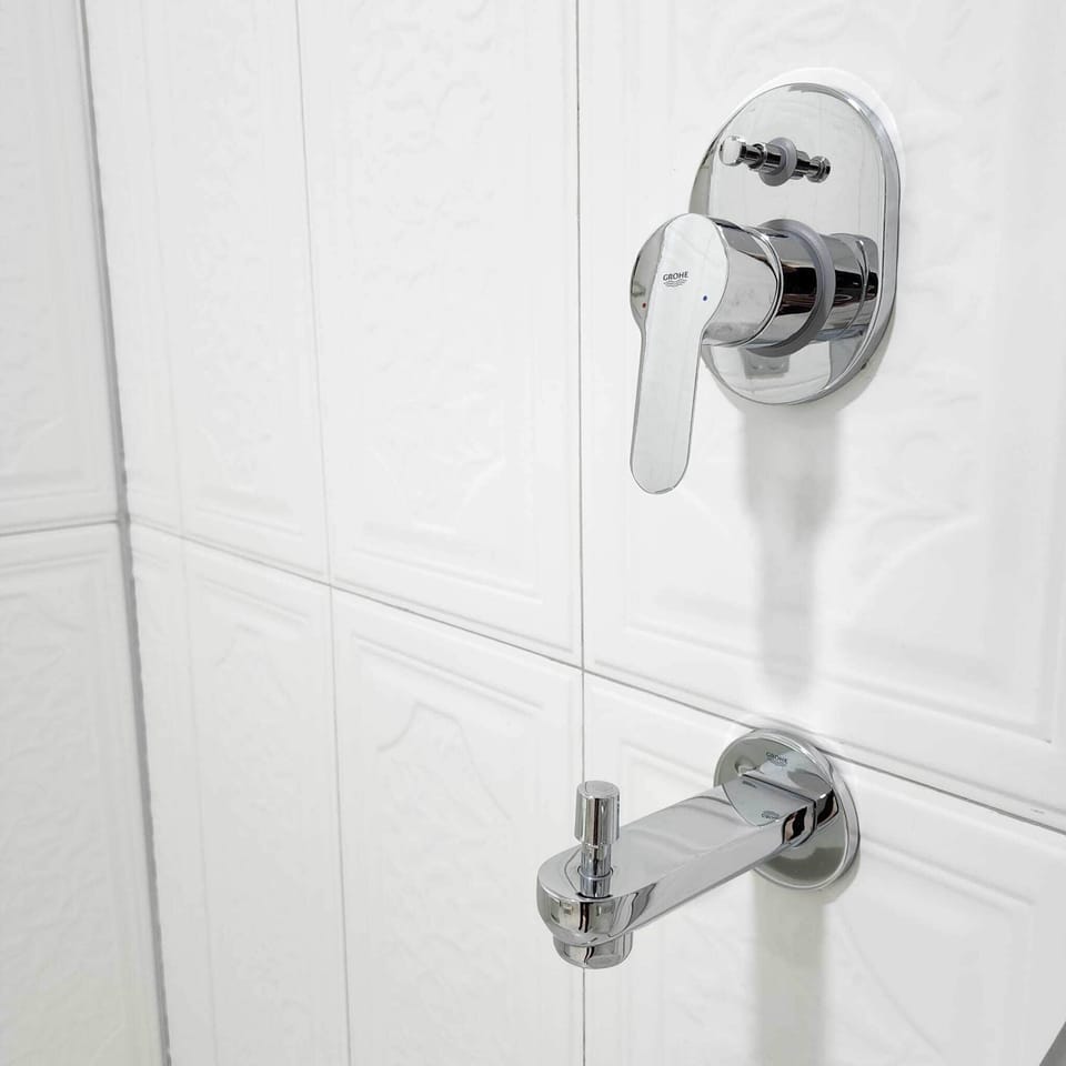 Shower, rainfall showerhead, designer toiletries, hair dryer