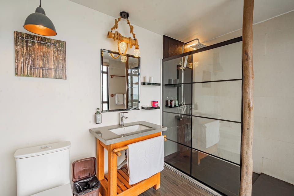 Shower, rainfall showerhead, slippers, towels