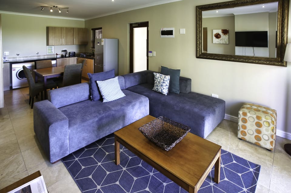 Comfort Apartment | Living area | 42-inch flat-screen TV with satellite channels