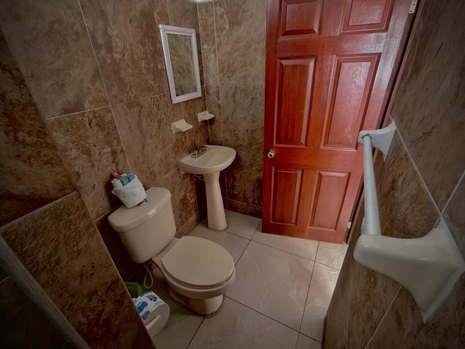 Standard Single Room | Bathroom | Shower, rainfall showerhead, heated floors (bathroom), towels