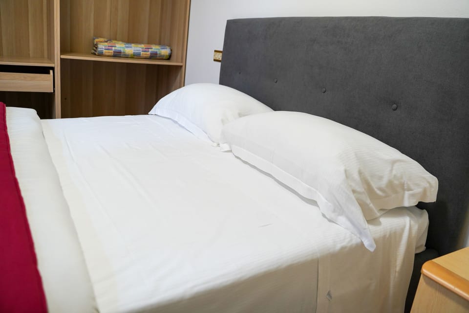 Comfort Room | 1 bedroom, in-room safe, desk, blackout drapes