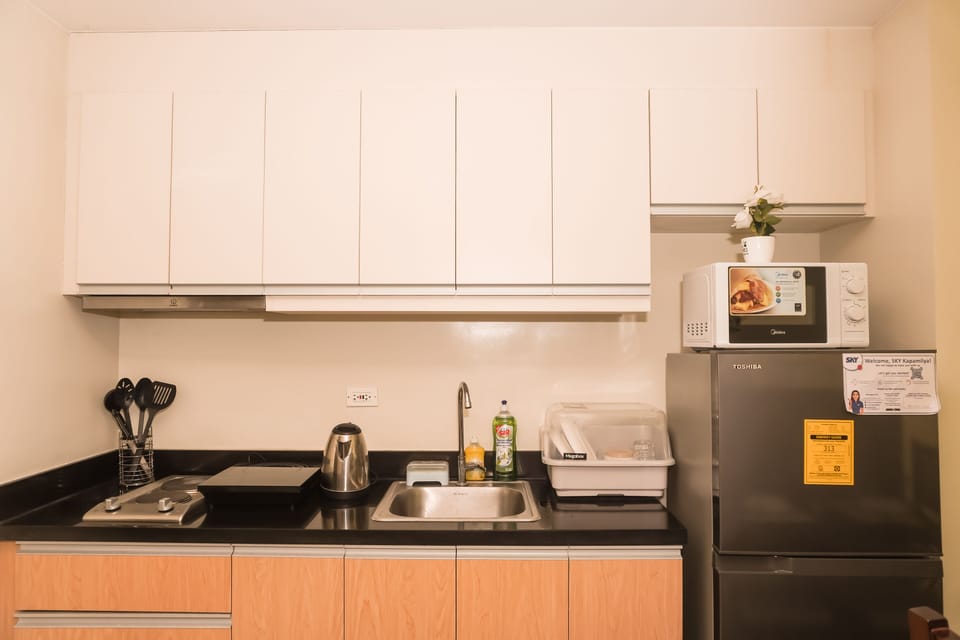 Exclusive Apartment | Private kitchen | Full-size fridge, microwave, oven, stovetop