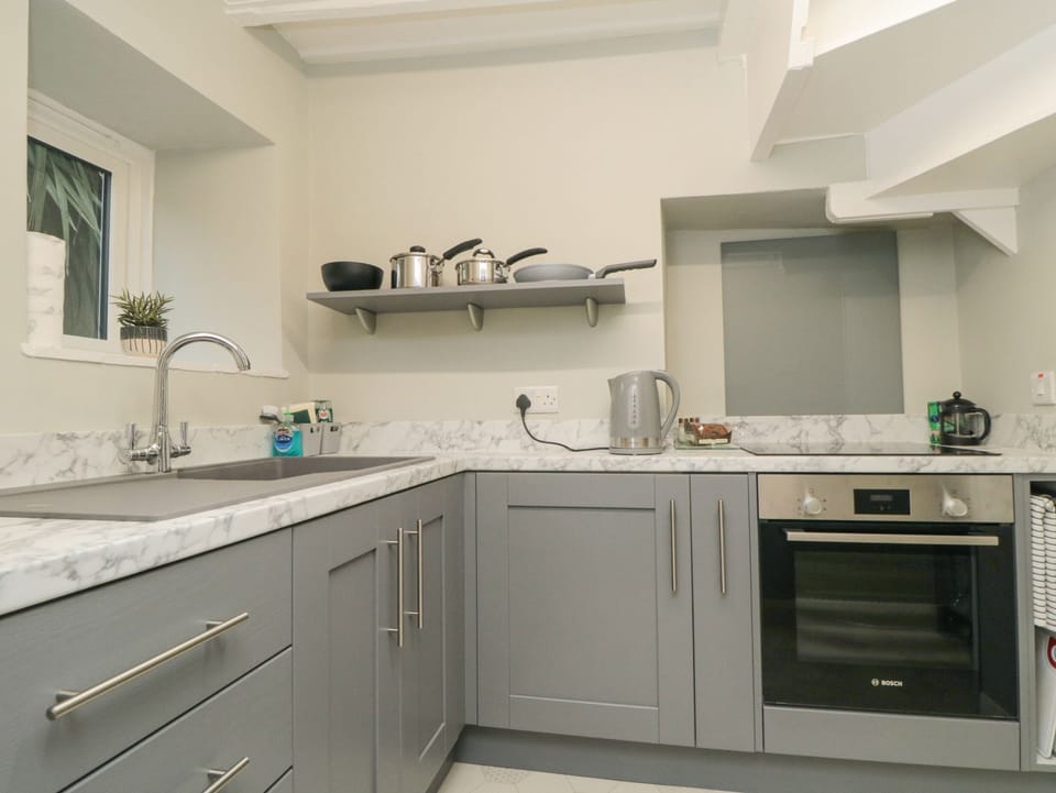 Fridge, electric kettle, toaster, cookware/dishes/utensils