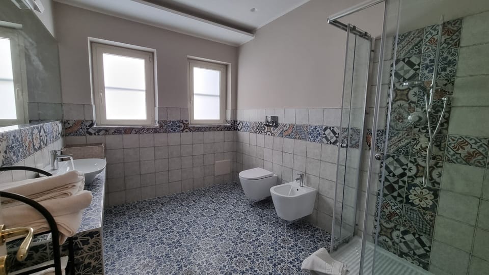 Comfort Room, Courtyard View | Bathroom | Free toiletries, hair dryer, slippers, bidet