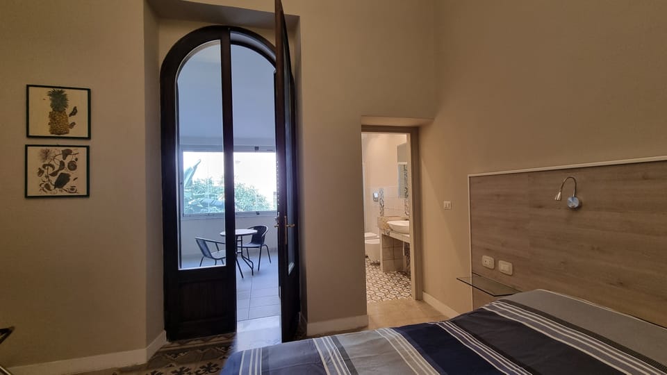 Comfort Room, Courtyard View | 1 bedroom, desk, laptop workspace, free WiFi