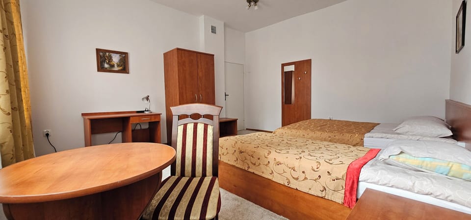 Desk, laptop workspace, bed sheets
