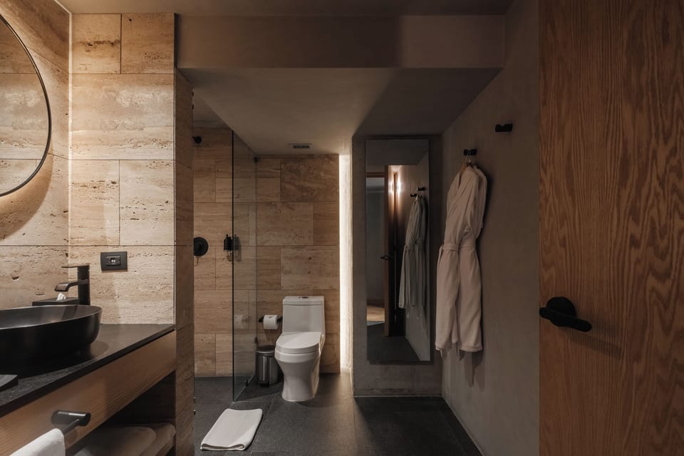 Contempo Queen Terraza | Bathroom | Shower, designer toiletries, hair dryer, bathrobes