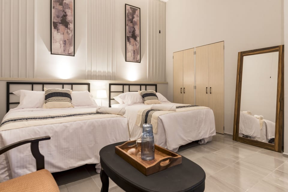 Economy Double Room, 2 Double Beds, Non Smoking | Down comforters, in-room safe, desk, laptop workspace