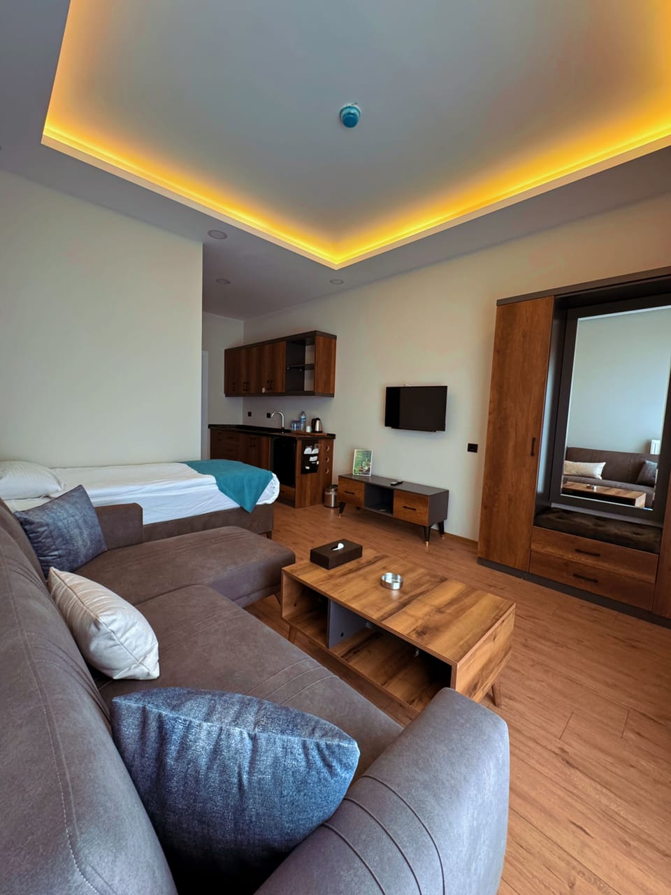 Junior Room, 2 Bedrooms | Living area | 32-inch Smart TV with cable channels