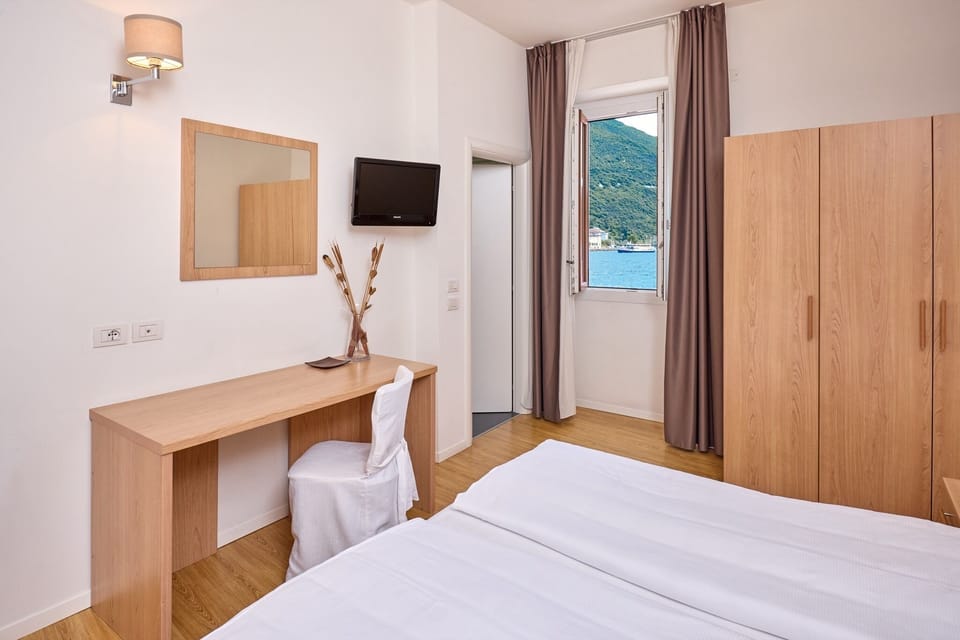 Panoramic Triple Room, Lake View | Premium bedding, down comforters, in-room safe, desk