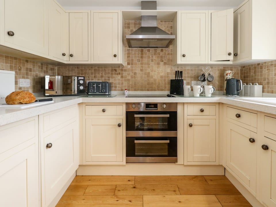 Fridge, electric kettle, toaster, cookware/dishes/utensils