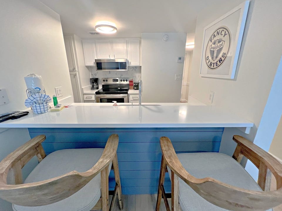 Condo, 1 Queen Bed with Sofa bed, Balcony, Pool View (Sugar Beach 306) | Private kitchen | Coffee/tea maker