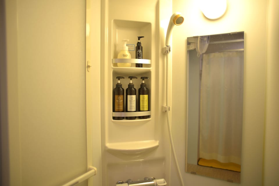 FemalePrivateCapsule (Tattoos not allowed) Shower Only, CO by 10AM each day even if consecutive stay | Blackout drapes, free WiFi, bed sheets