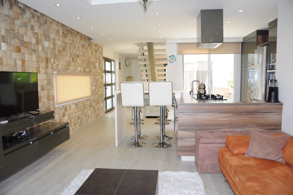 Exclusive Villa | Living area | 40-inch LCD TV with satellite channels