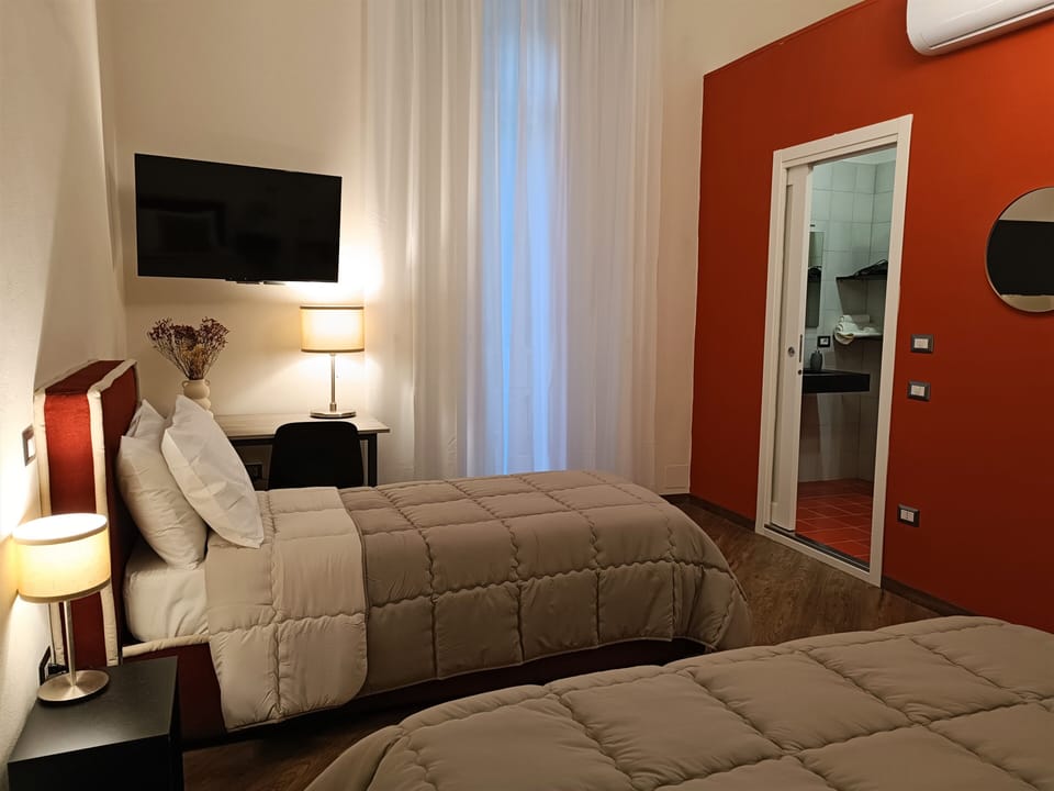 Family Room, City View | Down comforters, desk, laptop workspace, free WiFi