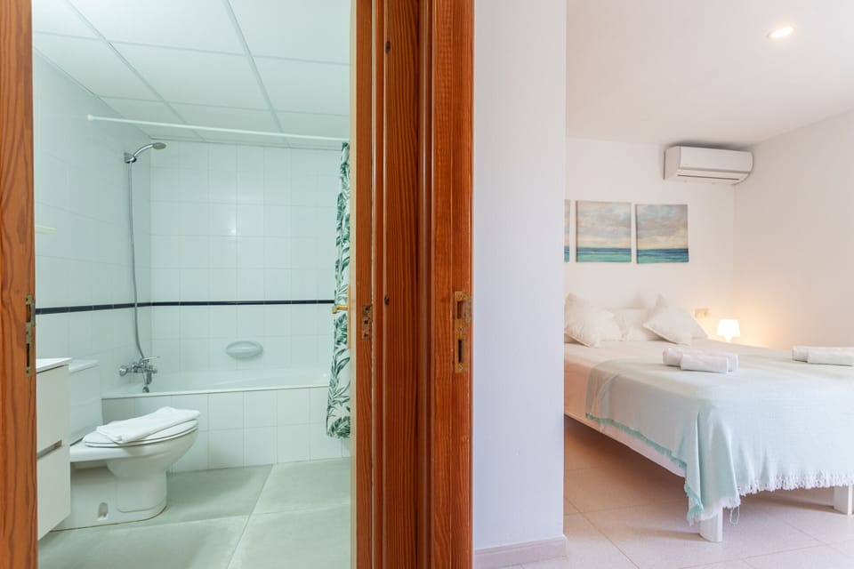 Bathtub, hair dryer, towels, soap