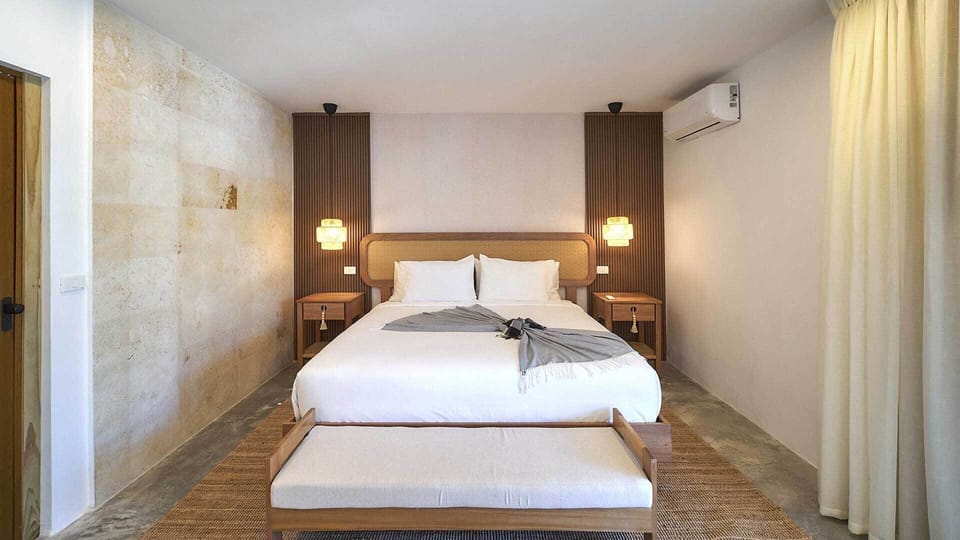 Junior Suite, Garden View | Pillowtop beds, minibar, in-room safe, blackout drapes
