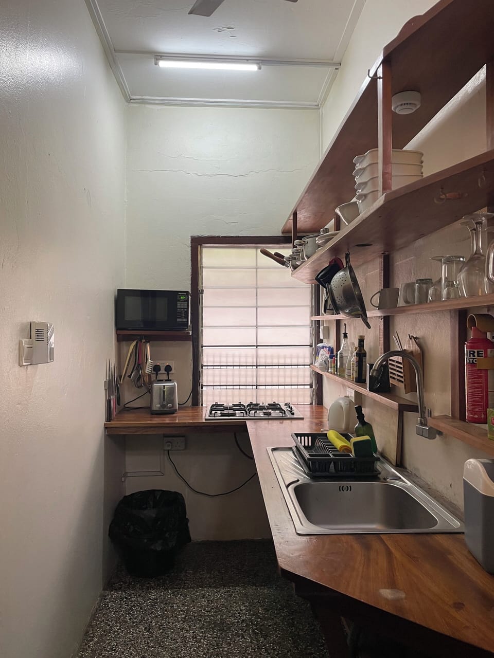Mini-fridge, shared microwave, stovetop, cookware/dishes/utensils