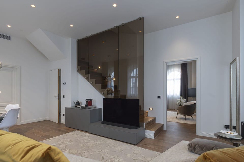 Luxury Suite, 2 Bedrooms | Living area | 45-inch Smart TV with digital channels, Netflix, heated floors