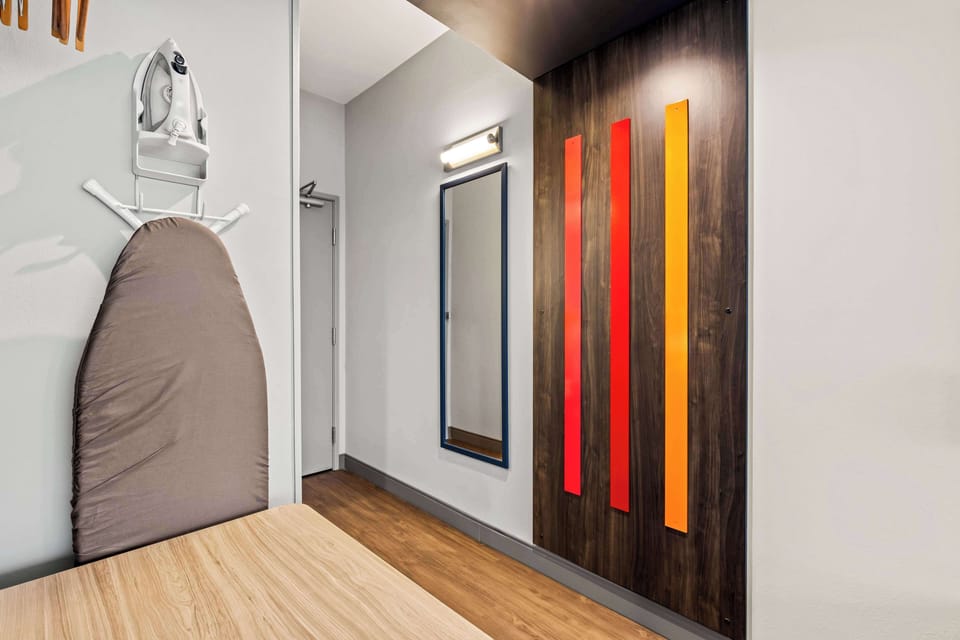 Desk, laptop workspace, blackout drapes, iron/ironing board