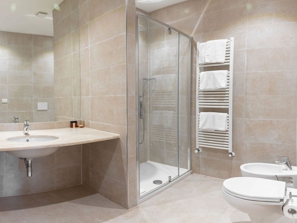 Suite, City View | Bathroom | Free toiletries, hair dryer, bidet, towels