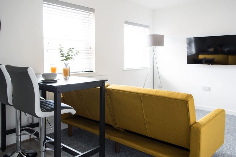 Comfort Apartment | Living area | 32-inch LED TV with cable channels, Netflix, streaming services