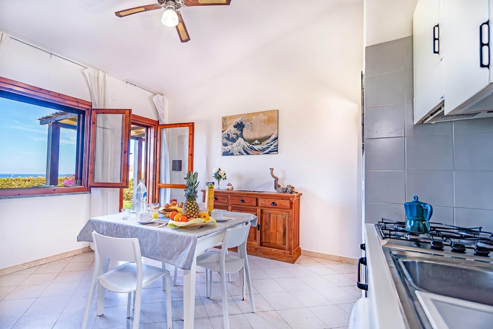 Standard Townhome, Multiple Bedrooms (1 Le Perle Di Stintino) | Private kitchen | Fridge, oven, stovetop, coffee/tea maker