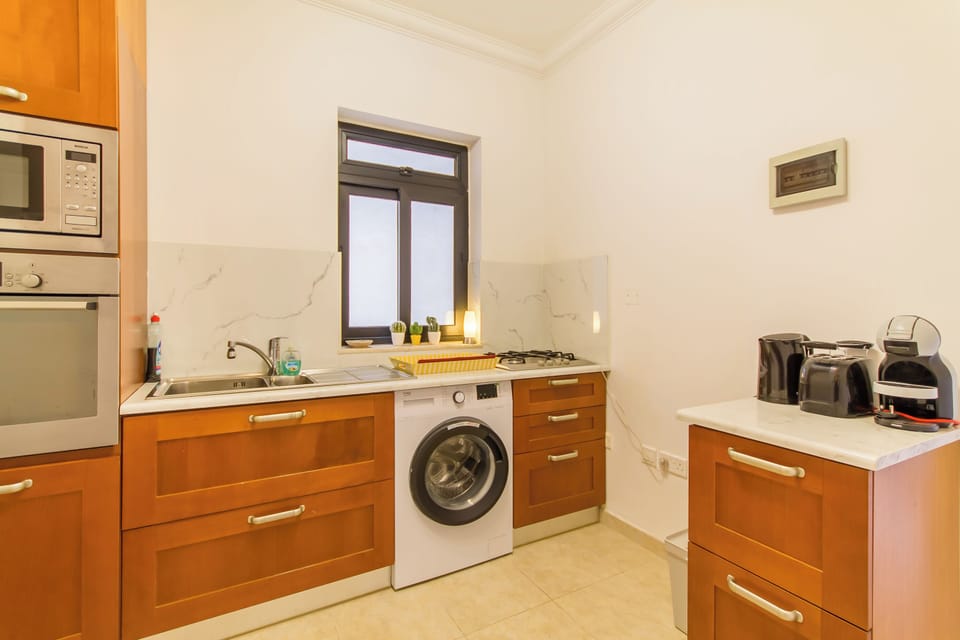 Family Apartment, Multiple Bedrooms, 2 Bathrooms (A Lovely Apart By The Sea Sliema) | Private kitchen | Fridge, microwave, stovetop, coffee/tea maker