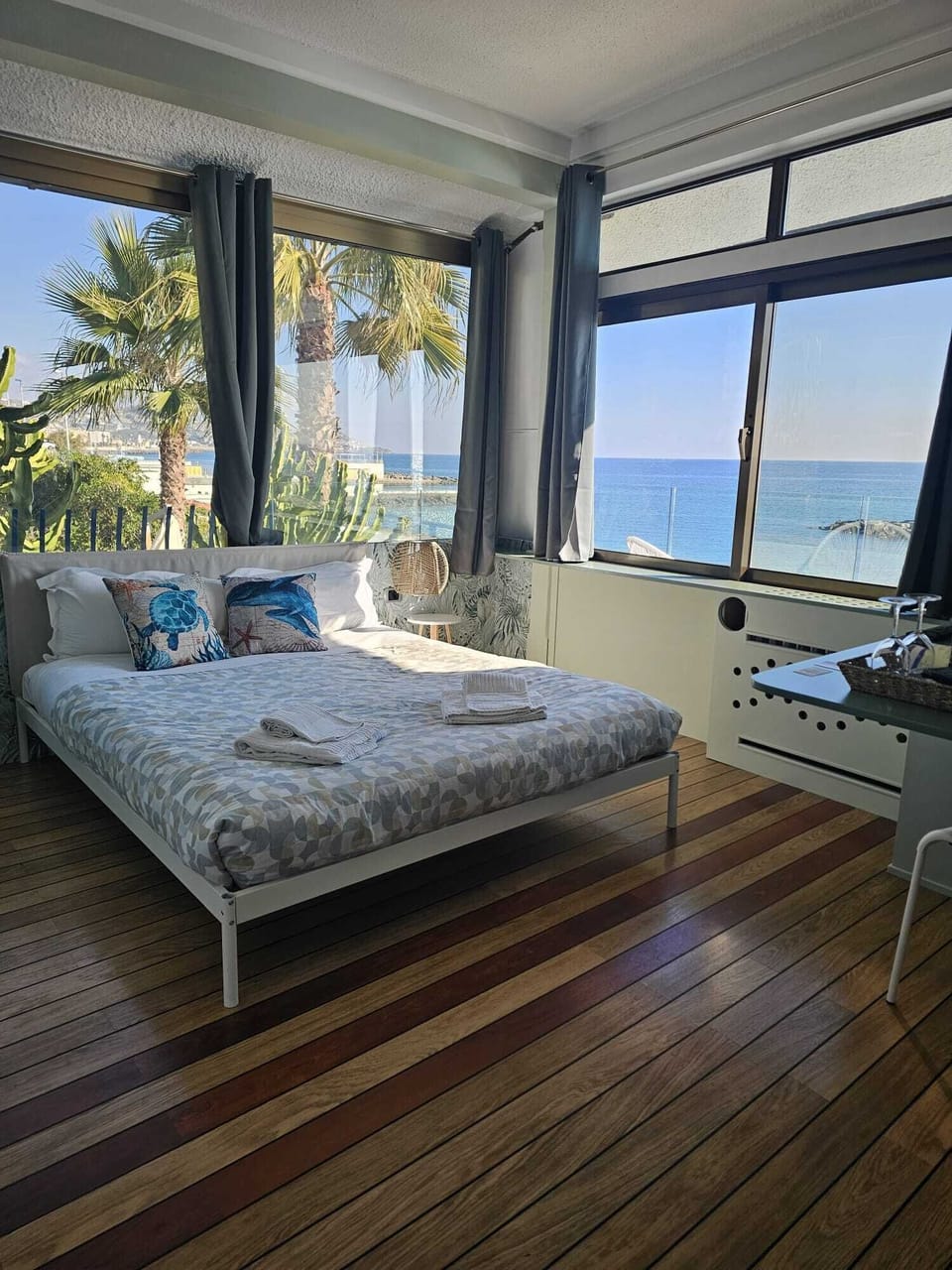 Deluxe Room, Balcony, Sea View | Minibar, in-room safe, desk, free WiFi