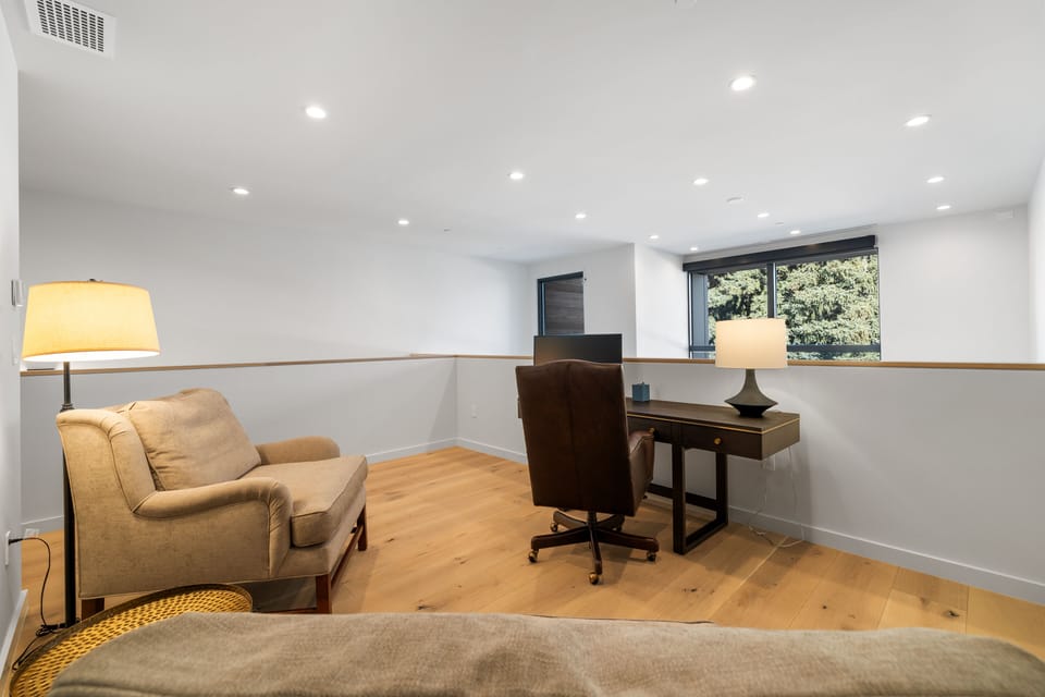 Luxury Townhome | Living area | 50-inch Smart TV with cable channels, fireplace