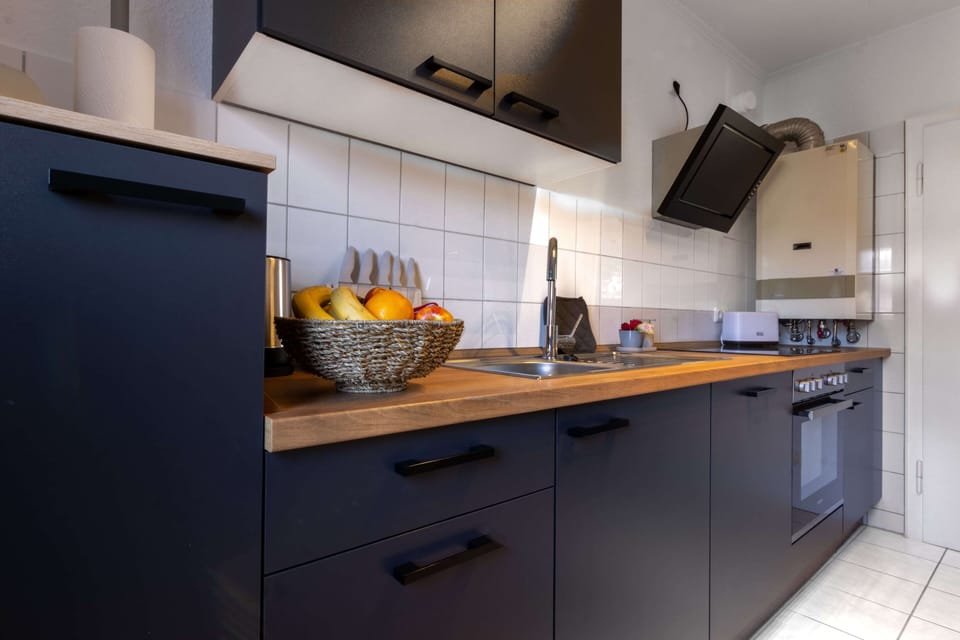 Family Apartment, 2 Bedrooms | Private kitchen | Fridge, microwave, stovetop, electric kettle