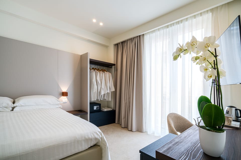 Design Room | Premium bedding, down comforters, memory foam beds, minibar