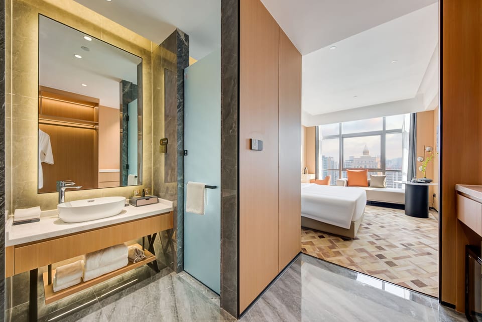 Deluxe King Bed Room | Minibar (free items), desk, blackout drapes, soundproofing