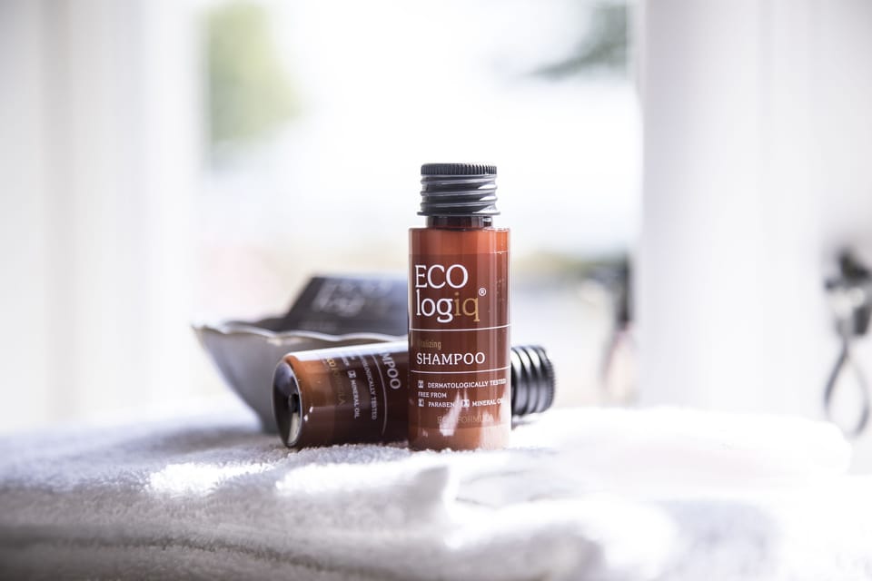 Shower, rainfall showerhead, hair dryer, towels