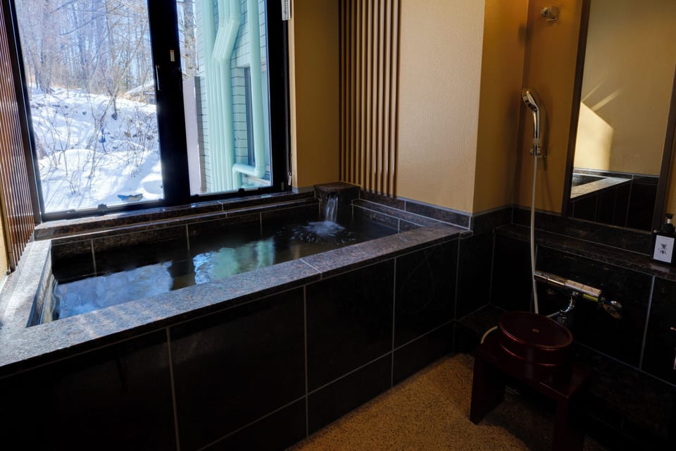 Quadruple Room | Bathroom | Combined shower/tub, deep soaking tub, slippers, towels