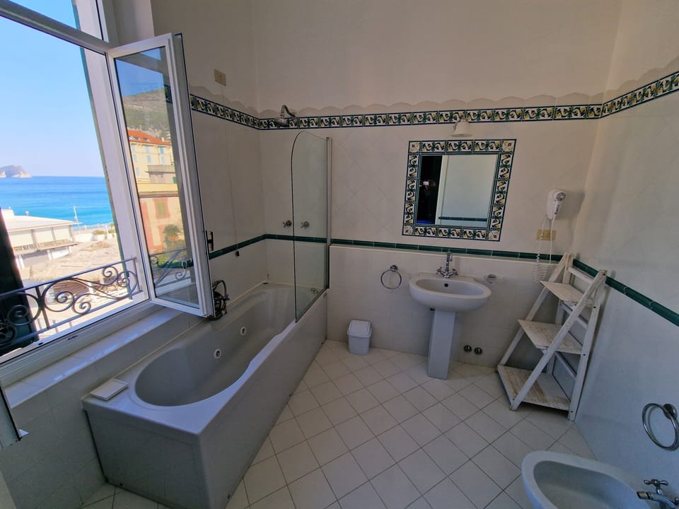 Double Room, Sea View | Bathroom | Hair dryer, bathrobes, bidet, towels