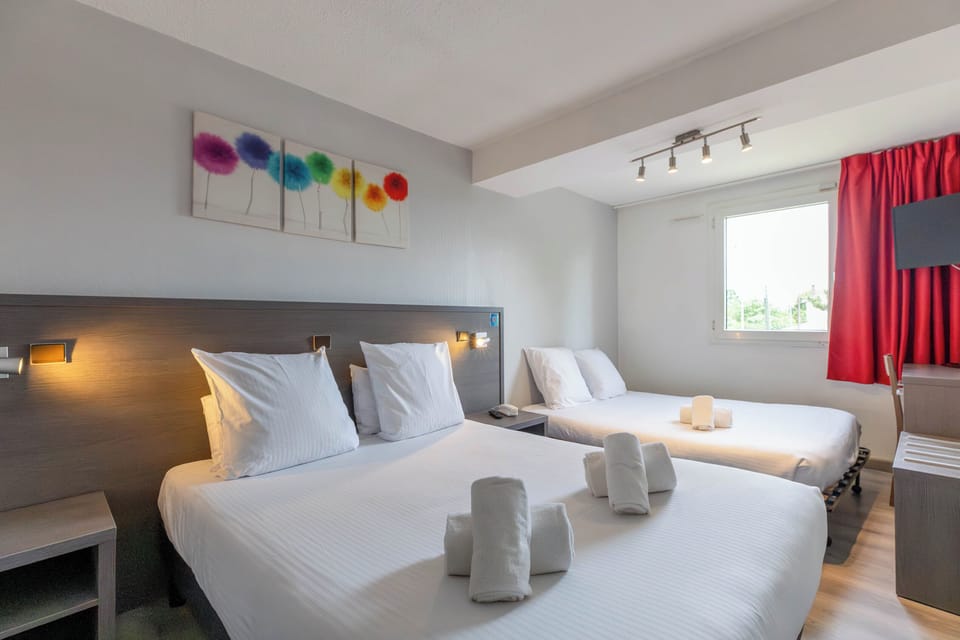 Comfort Room | Premium bedding, desk, blackout drapes, soundproofing