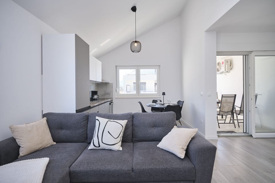 Apartment, Balcony, Bay View | Living area | 60-inch Smart TV with cable channels